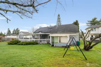 Back view of house; solar panels greatly reduce the electrical expense.