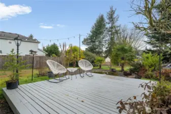 Large front deck has a beautiful setting for entertaining guests!