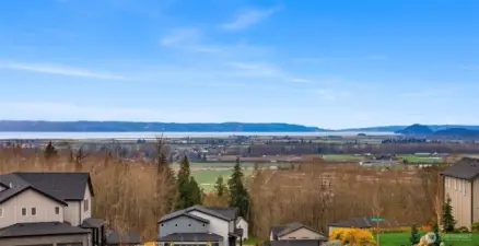 This is the view from the top of the hill looking west.  The lot does not have a Saltwater View.  It has a partial Lake View.