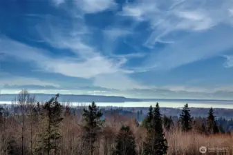This is the view from the top of the hill looking west.  The lot does not have a Saltwater View.  It has a partial Lake View.