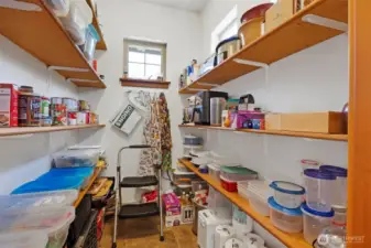 There is a large, walk-in pantry adjacent to the kitchen.