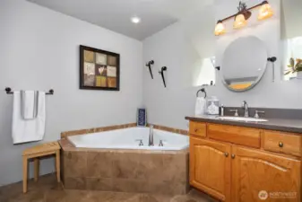 There is a corner soaking tub as well as a separate shower in the primary bath.