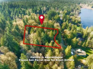 Aerial boundary lines illustrate the vast scale and privacy of this .552-acre lot.