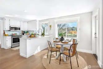 Updated kitchen with new backsplash, new stainless steel appliances and updated countertops.