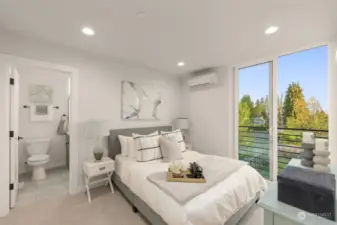Primary suite featuring a spacious bedroom with sliding doors that open to a private balcony, complemented by an en-suite bathroom for ultimate convenience.
