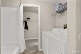 Full bath with laundry area.