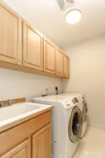 There is a separate laundry room on the main floor with a utility sink and abundant storage