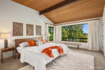 Your vaulted primary suite is a true retreat.