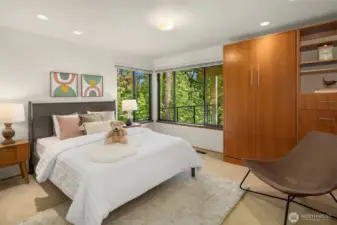 Generous 3rd bedroom with wrap-around windows & more custom built-ins with a Murphy bed!