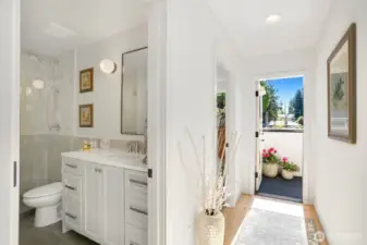 primary bathroom and stairs to rooftop deck