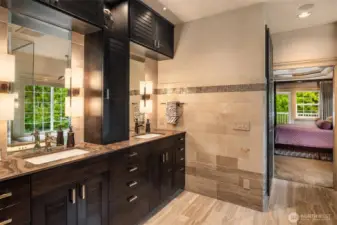 Experience the elegance of natural stone walls and floors, complemented by warm heated flooring and a comfort-controlled heated bidet.
