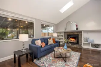 Living room with wood burning fire place and built ins.