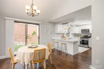 Dining room with access to outside area and kitchen area.