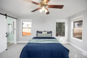 Primary bedroom with walk-in closet and ensuite bathroom.