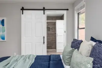 Primary bedroom with walk-in closet and ensuite bathroom.