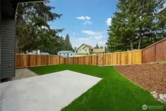 Side yard with new sod & NEW fence.