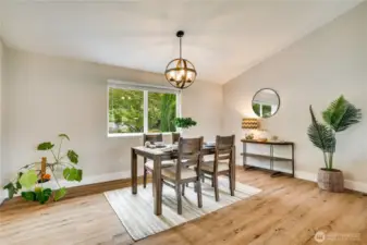 Set up a dining area by the window overlooking the back yard. With new lighting, new blinds, new flooring, and fresh paint, there's nothing left to do but sit and enjoy a meal.