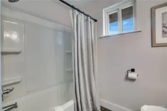 The full bath has new lighting, paint, and a new shower head in addition to recent updates by the previous homeowners.