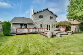 The homeowners also installed a sprinkler system for easier care of this beautiful, fully-fenced back yard.