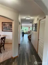 Entry w/ dining on left and living room/office to the right.