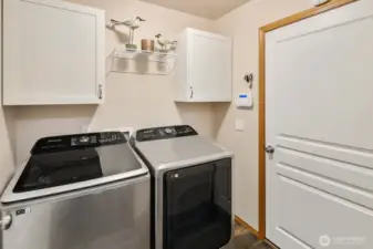 Downstairs laundry room with access to garage.