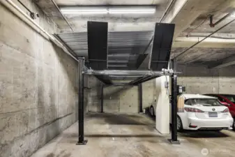 On the 1st floor, secured parking.  This spot is one of a few that has lift parking, allowing for 2 cars (or, use the top for storage).