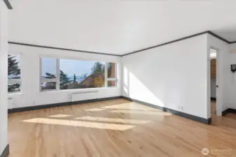 Light Filled living and dining with gleaming hardwood floors and fresh paint. All windows overlook the Puget Sound or Mt Rainier.