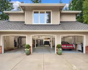Large 3 car garage with extra coverage in back barn.