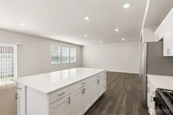 Beautiful large island with quartz countertop. hotos are representative only and may display different color package and/or upgrades.