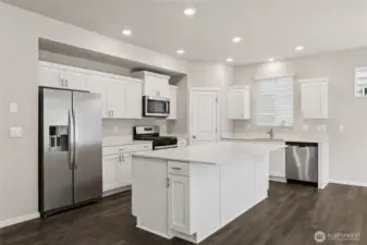 Nice corner pantry in kitchen area. Visit us 7 days a week  hotos are representative only and may display different color package and/or upgrades.