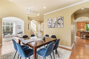 From the dining room, you can see the easy flow into the kitchen and appreciate the dramatic 2 story entry and elegant, arched doorways