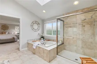 View from the primary bath into bedroom suite