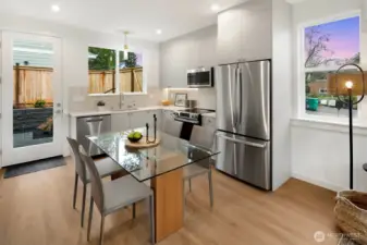 Kitchen has access to a landscaped backyard, patio with pavers and fully fenced.