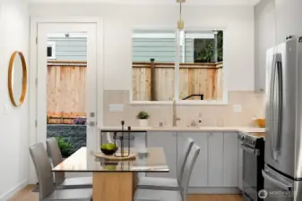 Kitchen has easy access to level backyard patio. Perfect for BBQ's and outdoor seating in the summer months.