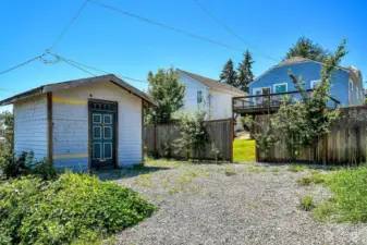 Off the paved alley you'll find additional off street parking and a large storage shed.