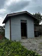 Good sized storage shed in back yard off of paved alley.