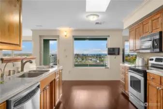 Kitchen overlooks the balcony and easterly views, to the right is the large family room .