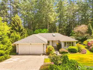 Mature landscaping, vibrate gardens & a well taken care of home!