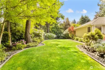 paved edging, pathways and river rocks surround the yard for easy maintenance