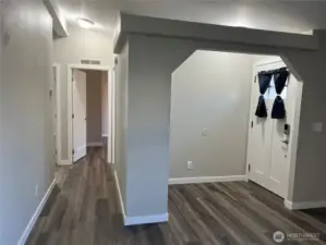 Entry and hallway to bedrooms looking from living room