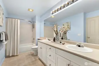 HUGE primary bath with double vanities and great storage.