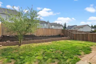 Fully fenced backyard off kitchen