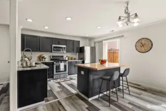 Bright and open kitchen with center island, completely updated