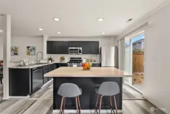 Gorgeous kitchen with sliding doors to the backyard