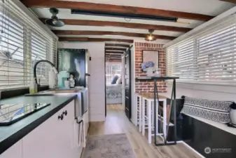 This sweet houseboat has EVERYTHING! Built-in galley eating bar with storage underneath the benches.