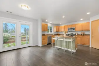 Beautiful french doors lead to patio and fully fenced back yard.