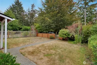 View from the side looking at the fully fenced front yard