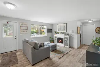 Through the front door you're welcomed into the airy living space with laminate flooring and freshly painted white doors and trim. The fireplace is not built in and does not come with the home.