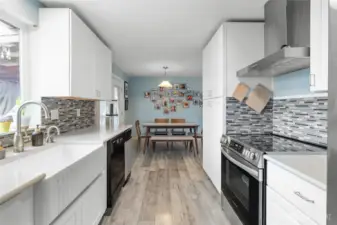 From the other end of the kitchen, you can see the dining area.