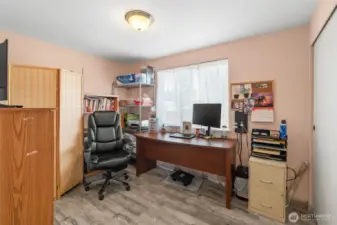 This bedroom is located at the opposite end of the home from the primary and is at the back of the home.